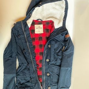 Hollister winter coat in navy blue with red flannel interior